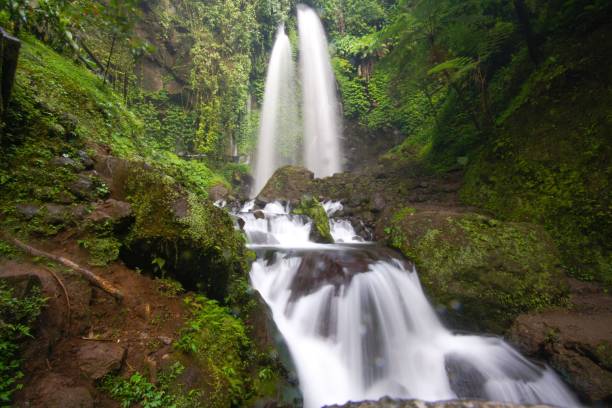 istock Closeup of beautiful Jumong Waterfall in rainforest located in Karanganyar, Central Java, Indonesia 1447078497