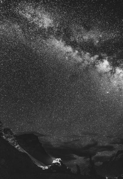 istock Vertical grayscale view of a stunning starry night sky in a valley 1447079211