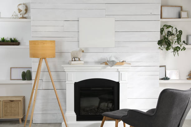 istock Stylish living room interior with empty canvas on white wooden wall. Mockup for design 1447081165