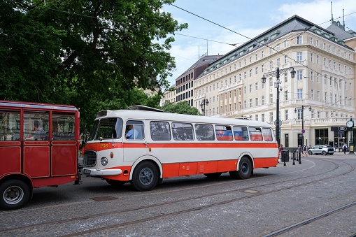 Bratislava, Slovakia – June 04, 2022: A red white bus near the National Theatre in Hviezdoslav Square in Bratislava, Slovakia