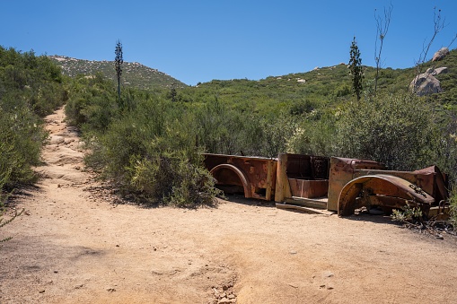 Abadoned rusty truck on the side of El Cajon Mountain in San Diego