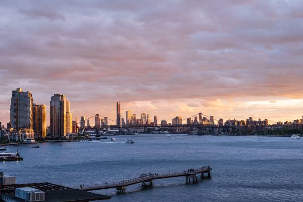 istock Evening sunset sky over the water with the New York skyline 1447083792