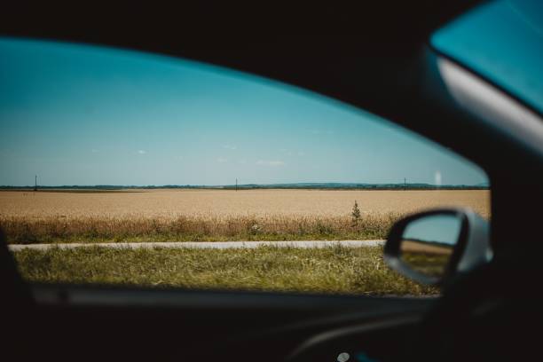 istock View of fields from a car window 1447084271