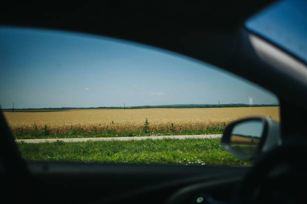 istock Fields from the window of a car 1447084273