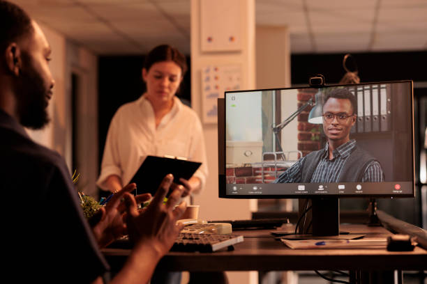 istock African american man talking with executive manager on videoconference 1447085627