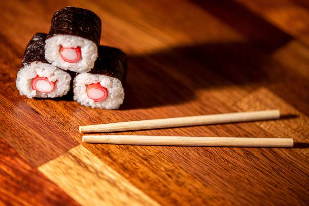 istock Japanese sushi rolls on a wooden table 1447085776
