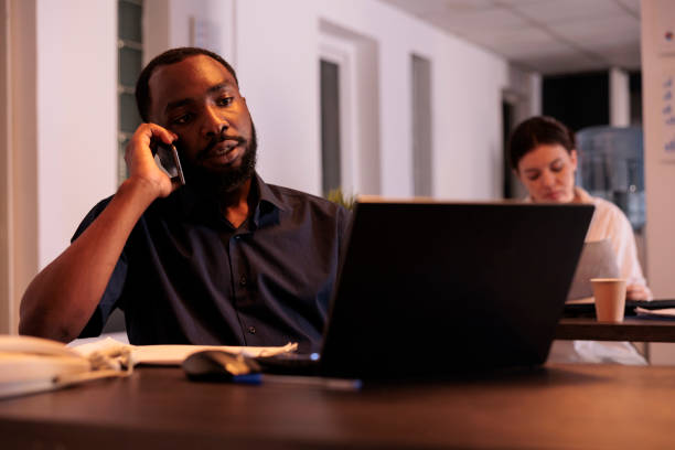 istock Corporate worker discussing project plan with teamlead on smartphone 1447086217
