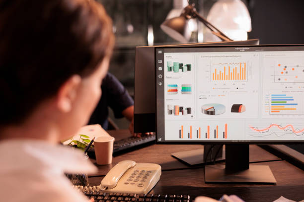 istock Woman reading corporate marketing report on computer screen 1447086946