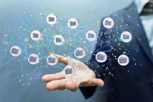 istock Man holding the virtual internet data infrastructure concept in his hand. 1447087284