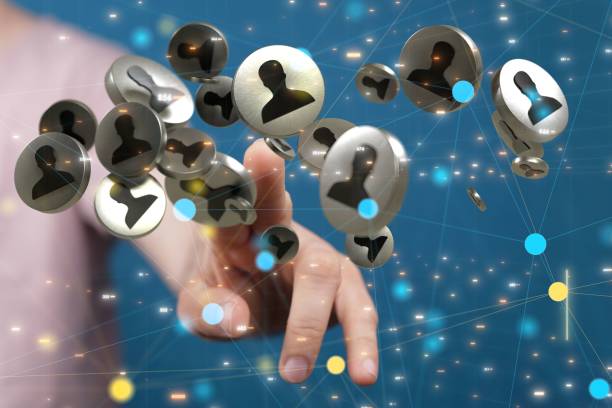 istock Male man's finger touching the male figurine icon display. Networking concept 1447087330