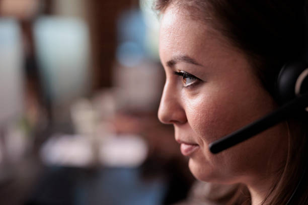 istock Telemarketing sales worker answering client call on headset 1447087630
