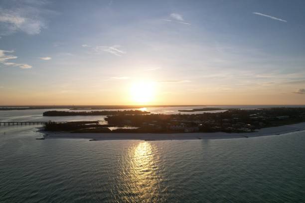 Aerial view of Longboat Key against scenic sunrise in Florida, USA An aerial view of Longboat Key against scenic sunrise in Florida, USA longboat key stock pictures, royalty-free photos & images