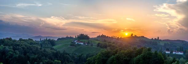 istock Panoramic shot of a landscape under the orange sunset 1447088540