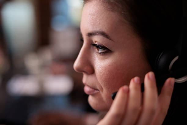 istock Call center operator helping clients on telemarketing helpline 1447089023