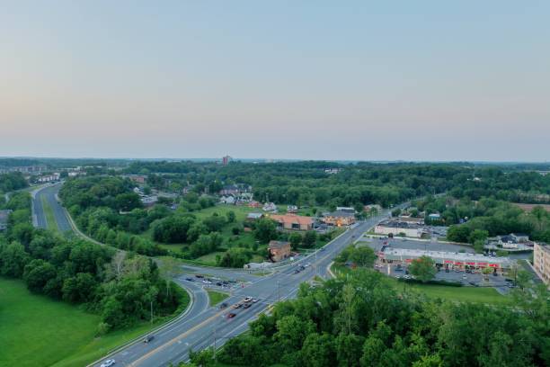 istock Aerial view of highway intersections surrounded by lush green trees 1447089381