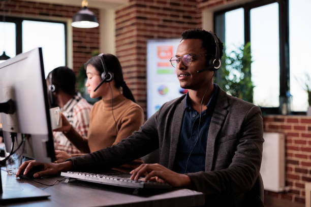 istock African american helpline employee working at call center 1447089541