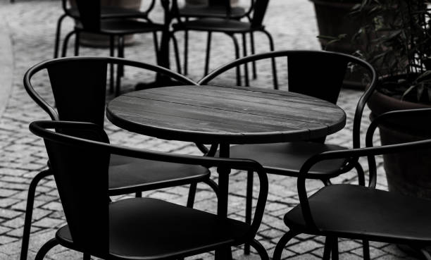 istock empty black tables and chairs of restaurant 1447089878
