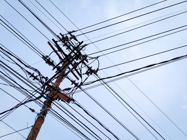 istock Electrical power junction at the pole reveals the complexity with the bright blue sky clouds 1447092112