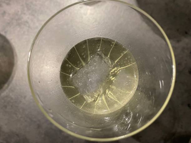 istock Champagne glass with ice cubes seen from above 1447092132