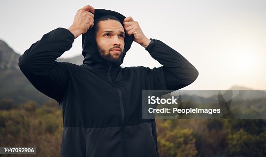 istock Hiking man, nature and morning fitness for freedom, running and exercise in mountains, adventure and wellness. Focus mindset of thinking runner with hoodie for cold, calm and healthy training workout 1447092906