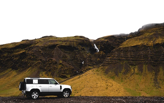Backcountry, Iceland – June 21, 2022: A Land Rover Defender with mountains in the background in Iceland.