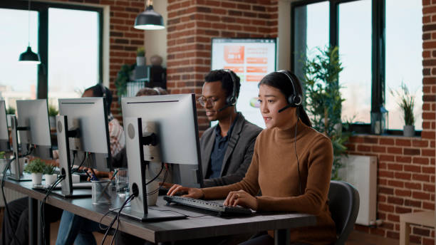 istock Multiethnic team of people working at call center office 1447093706