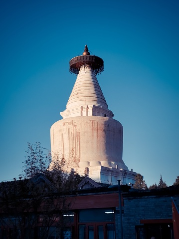A vertical shot of the White Pagoda of Miaoying temple in Beijing