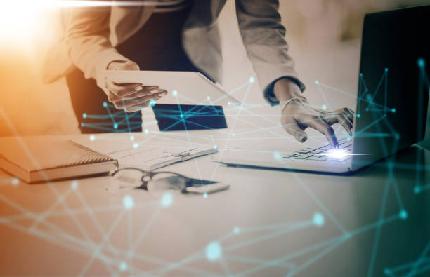istock Business, laptop and digital transformation with tablet in networking with technology and data nodes at the office. Corporate manager on computer in communication, IoT and futuristic network at work 1447095760