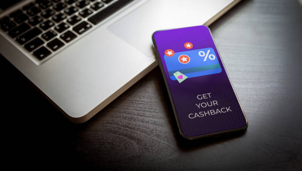 istock Cashback loyalty program concept. Customer rewards and money refund service. Smartphone with discount card with rewarding marketing points on the screen and text - get your cashback. 1447095819