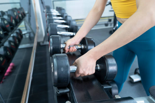 istock Action gesture before preparing to lift a dumbbell 1447096688