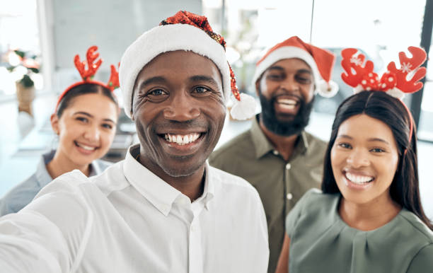 istock Office team selfie, Christmas party and celebration with a smile. Diversity, hard workers and happy business people celebrating together after success, good finance or financial year at the company. 1447097978