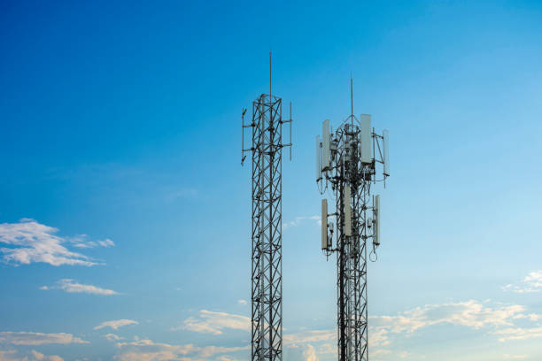 istock 4G and 5G wireless communication antenna transmitter. Telecommunication towers with clouds on blue sky background. 1447099104