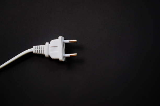 istock Electric European plug isolated on black background 1447100080
