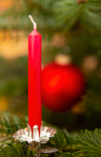 Decorated Christmas tree with red candle