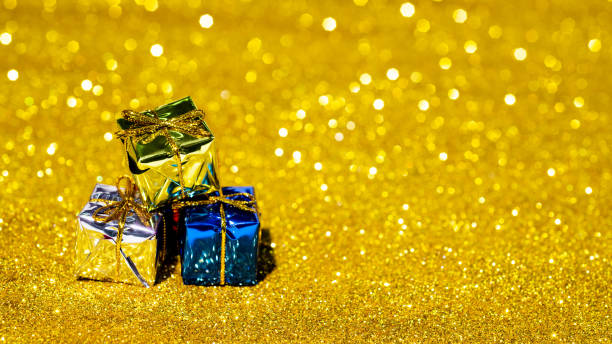 istock Christmas gifts on shiny background 1447102143