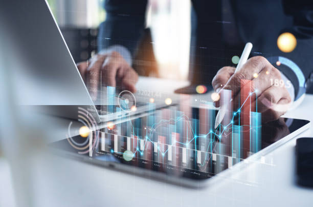 istock Businessman analyzing financial data, economic growth graph chart on digital tablet. Business planning and strategy. Analyzing trading of exchange, financial report. Finance and investment 1447102652