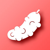 istock Pickle. Icon on Red background with shadow 1447103668