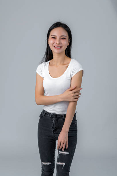 istock Confident woman over gray background 1447103712