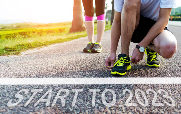 istock Two people waiting behind the line , with word start 1447104170