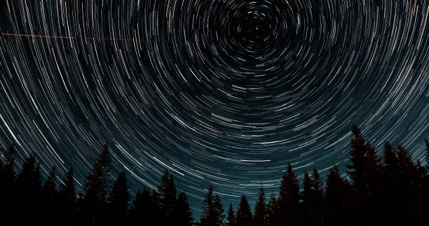 istock Star trails in the night sky 1447105408