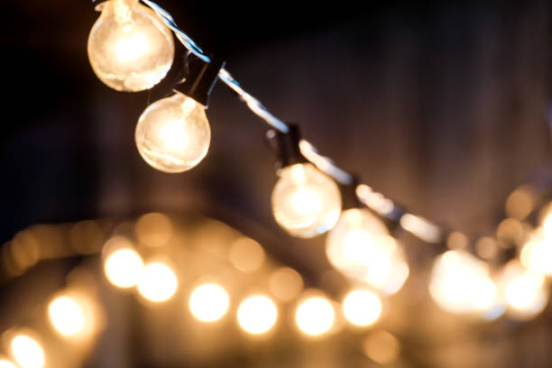 istock blurred, Lamps hanging night party with bokeh background. 1447106506