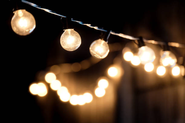 istock selective focus, Lamps hanging night party with bokeh background. 1447106513