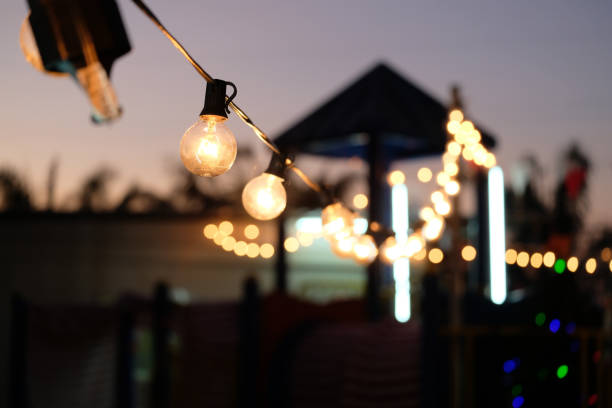 istock selective focus, Lamps hanging night party with bokeh background. 1447106515