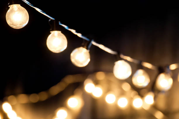 istock selective focus, Lamps hanging night party with bokeh background. 1447106516