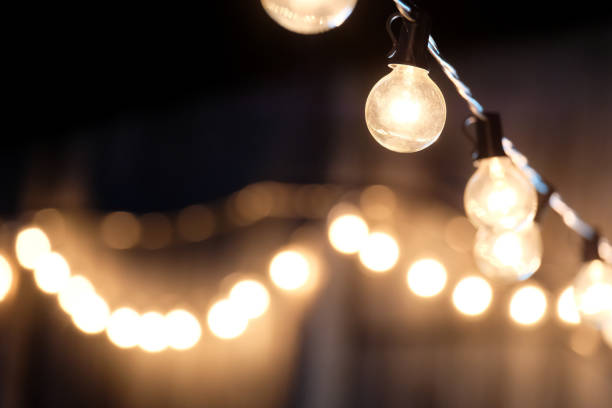 istock selective focus, Lamps hanging night party with bokeh background. 1447106520