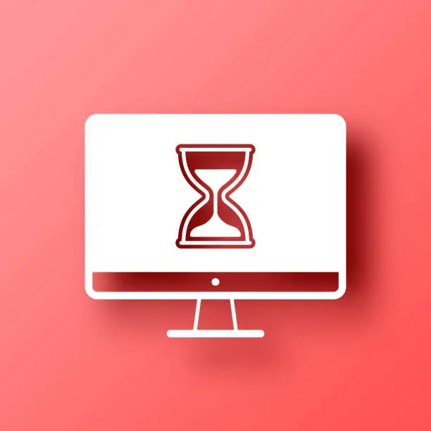 Vector illustration of Desktop computer with hourglass. Icon on Red background with shadow