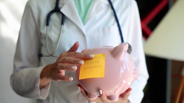 Therapist puts health insurance sticker on piggy bank