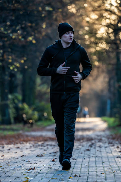 istock Jogging in the autumn park. 1447108909