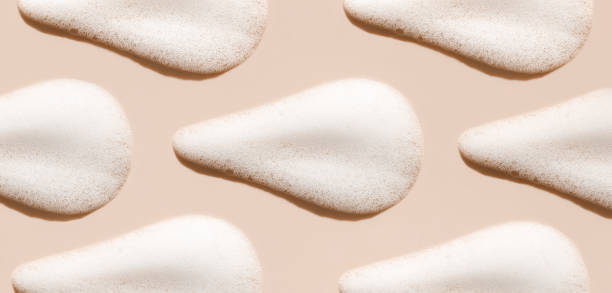 pattern texture foam mousse foam cosmetic smear sample on beige background