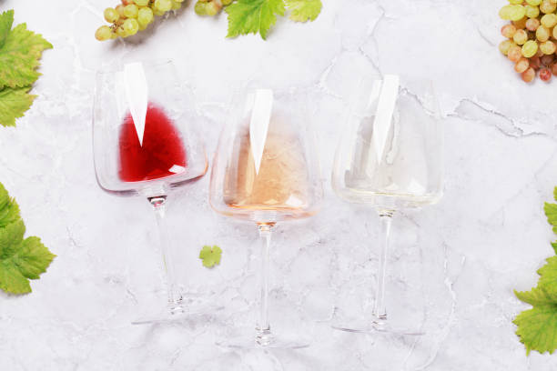 istock White, rose and red wine glasses and grape 1447110193